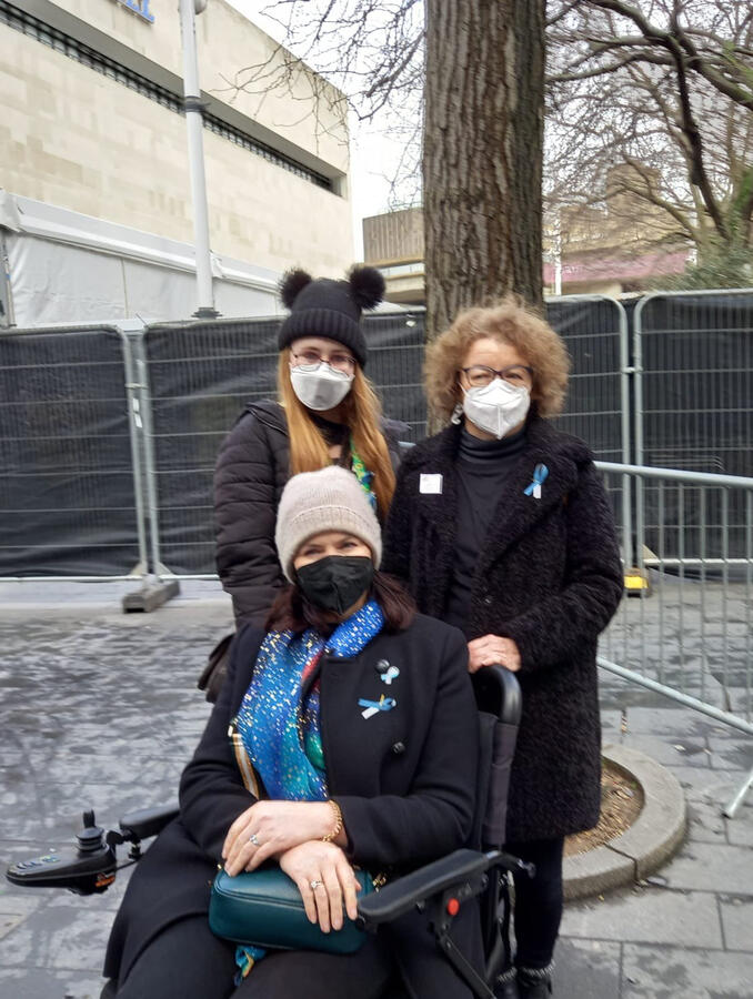 Protect the Heart of the arts campaign members wearing respirators. Campaign member in power chair.